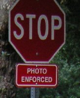 Stop sign with small 'Photo Enforced' warning sign, Franklin Canyon